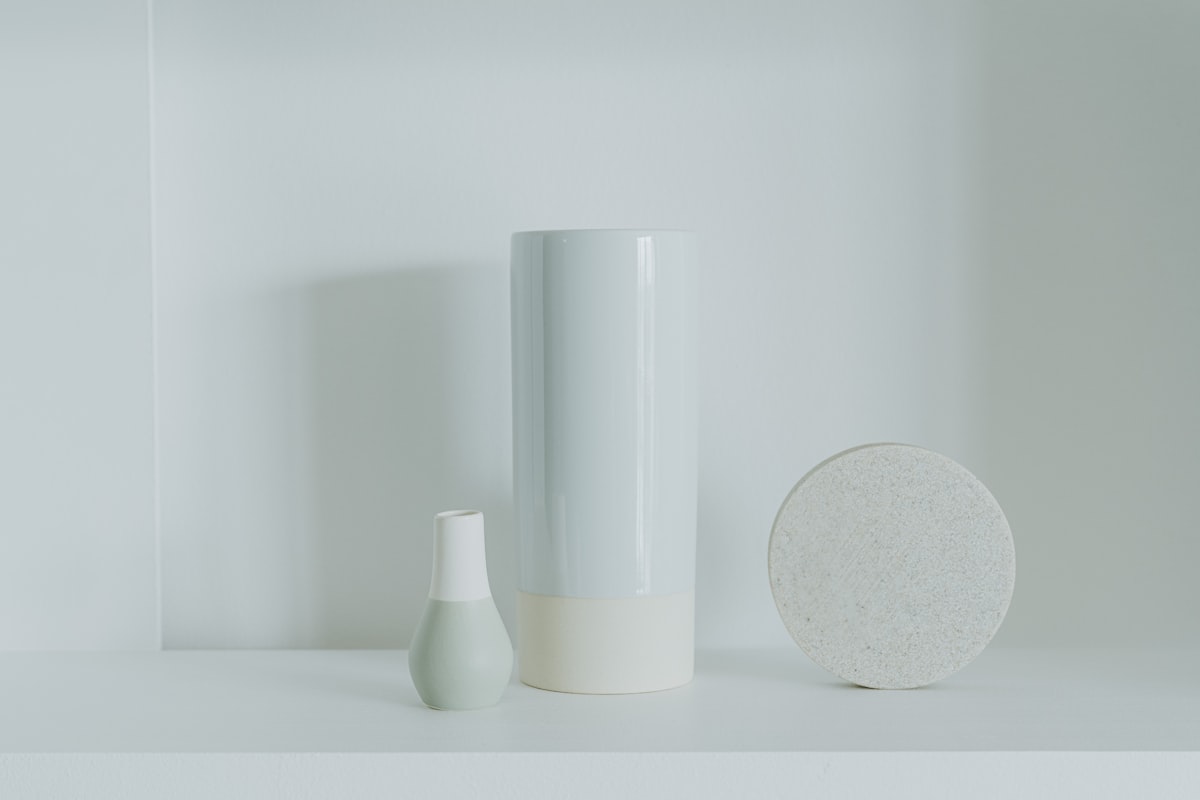 Skincare product bottles on neutral background